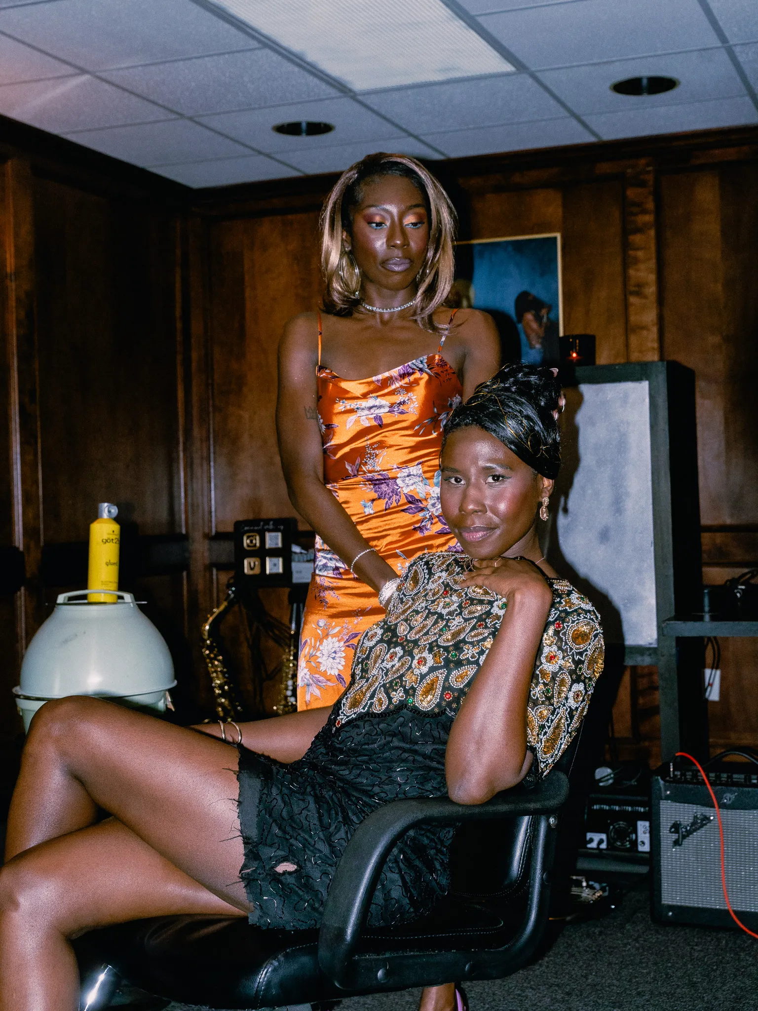 Nala seated backstage in a beaded top
