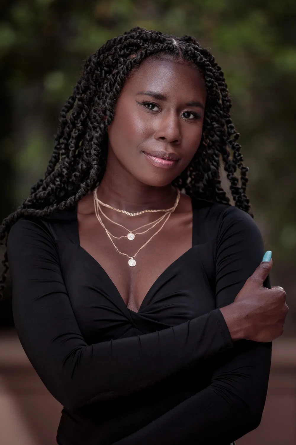 Close-up portrait of Nala wearing layered necklaces